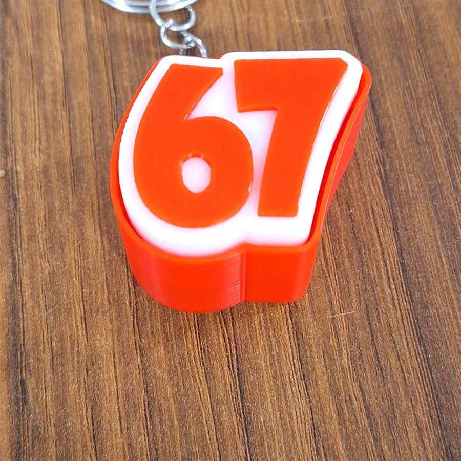 קליקר 67 כתום עם מחזיק מפתחות