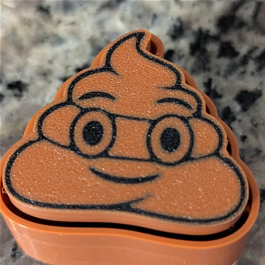 קליקר קקי חום מחייך